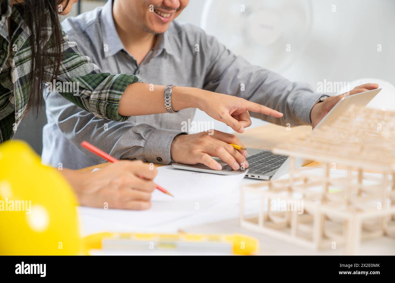 Two architects are working together in the office Stock Photo
