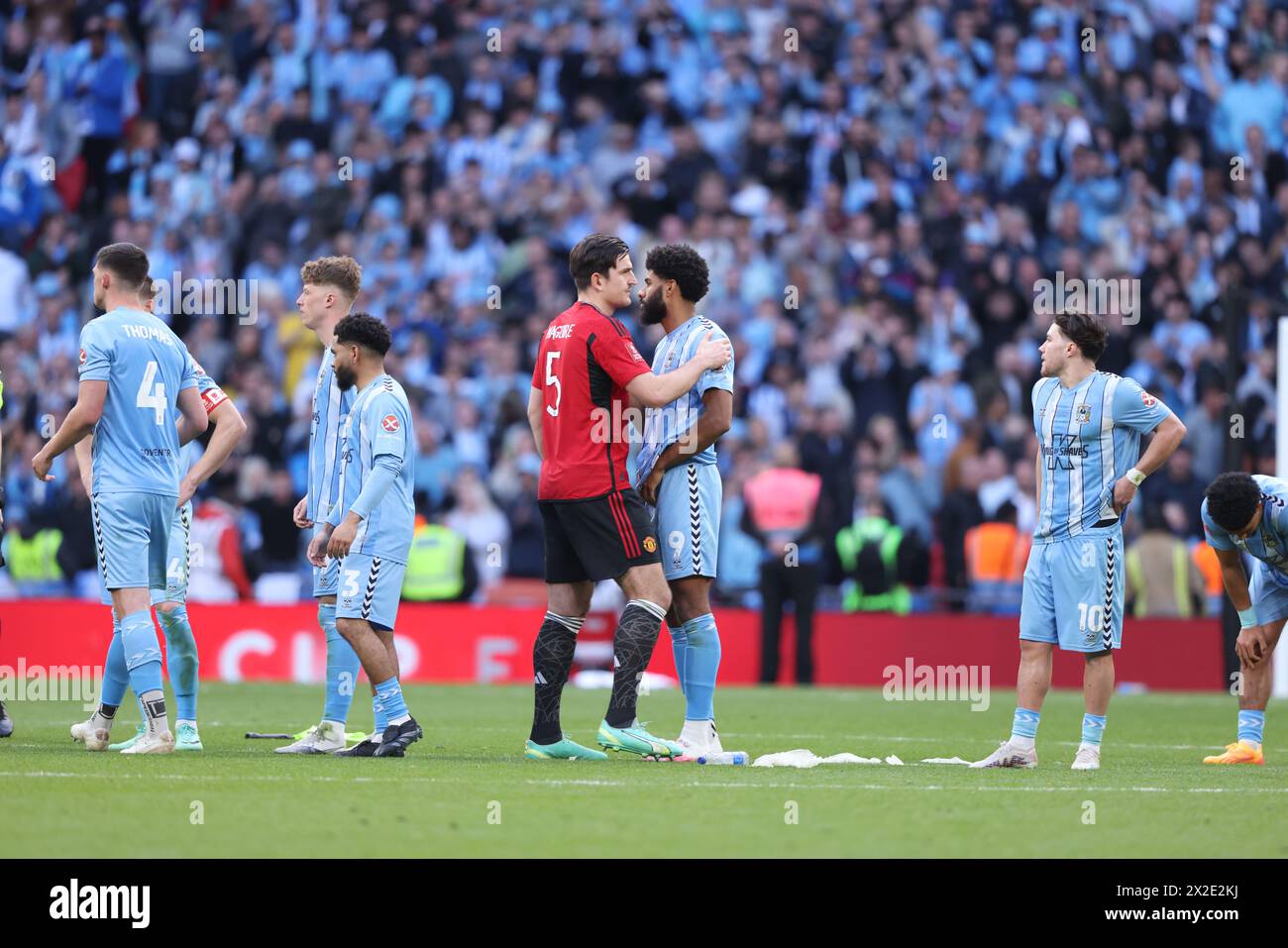 London, UK. 21st Apr, 2024. Harry Maguire (MU) consoles Ellis Simms (CC) after the penalty shoot-out at the Emirates FA Cup Semi-Final match, Coventry City v Manchester United, at Wembley Stadium, London, UK on 21st April, 2024 Credit: Paul Marriott/Alamy Live News Stock Photo