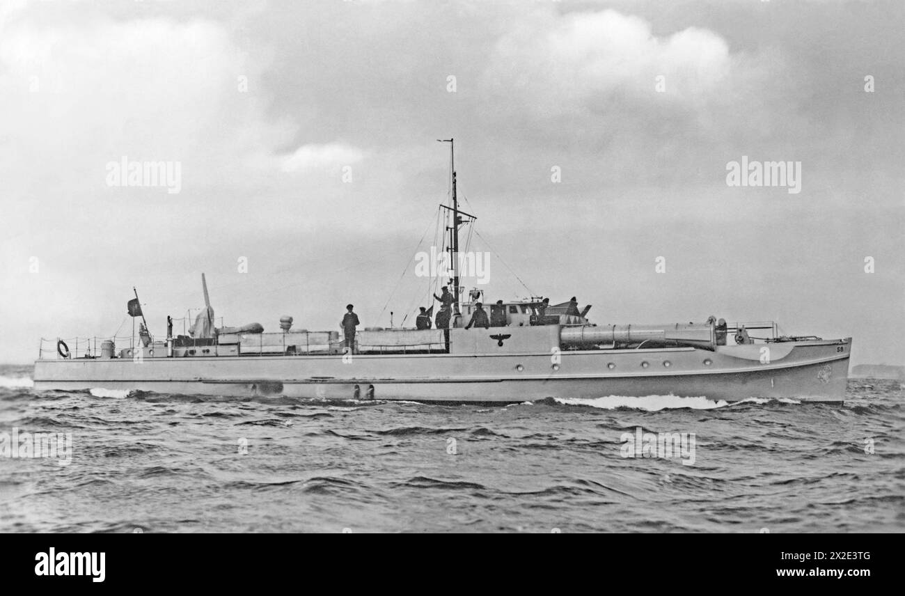 A view at sea of a German Schnellboot, S8 c.1940 during World War II. These fast-attack craft (S-Boots, Schnellboote or ‘fast boats’) of the Kriegsmarine during World War II were often called E-boats by the allies. S8 was a S7-class vessel, diesel powered and carried large 533mm (21-inch) torpedos. The two torpedo tubes were mounted on the forecastle. It had a crew of 18 (later 21) men. S8 was built in 1934 – she was scuttled in the North Sea in 1945 – a vintage 1940s photograph. Stock Photo