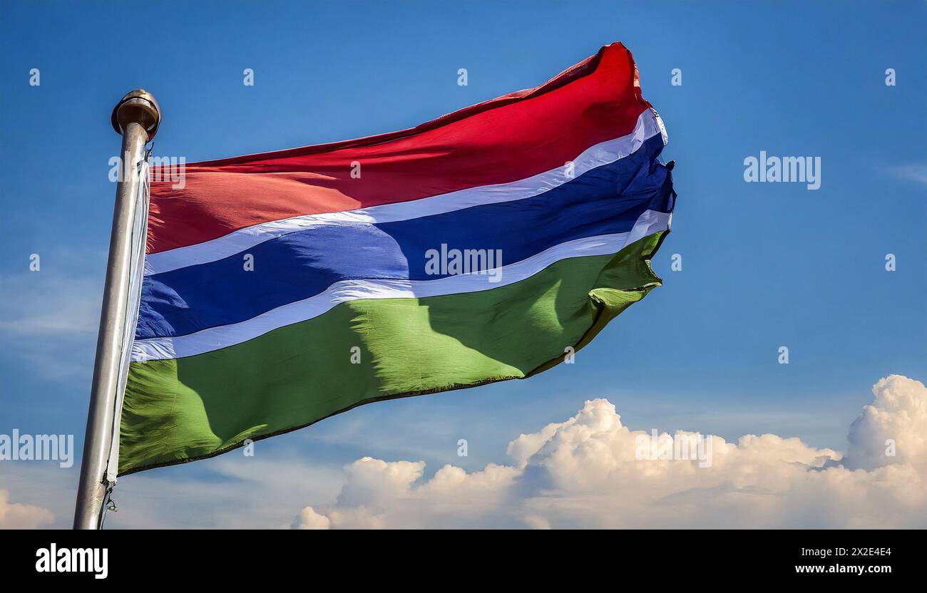Die Fahne von Gambia, flattert im Wind, isoliert, gegen den blauen Himmel Stock Photo