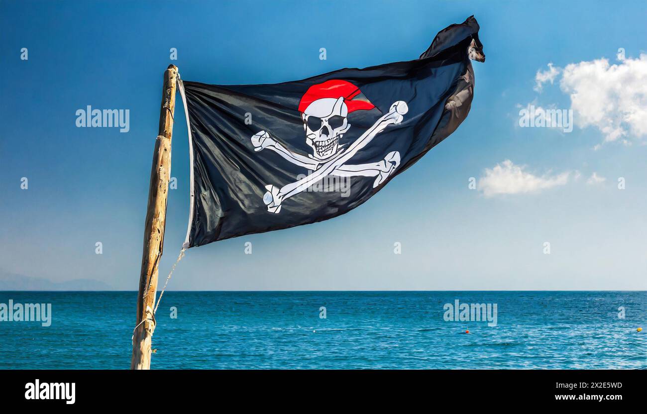 Die Piratenflagge flattert im Wind, isoliert, gegen den blauen Himmel Stock Photo