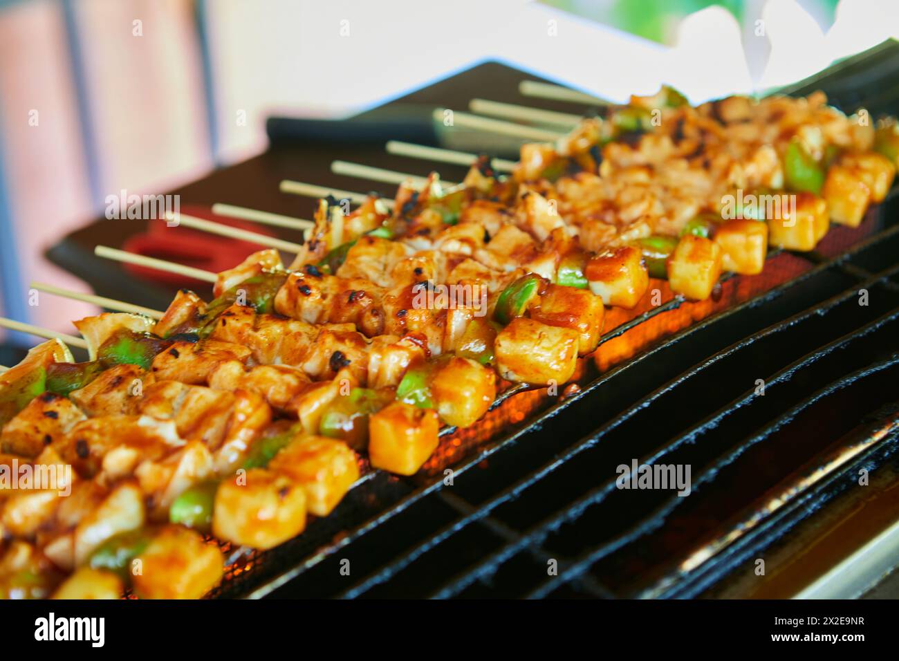 Grilling skewer chicken meat on barbecue grill Stock Photo