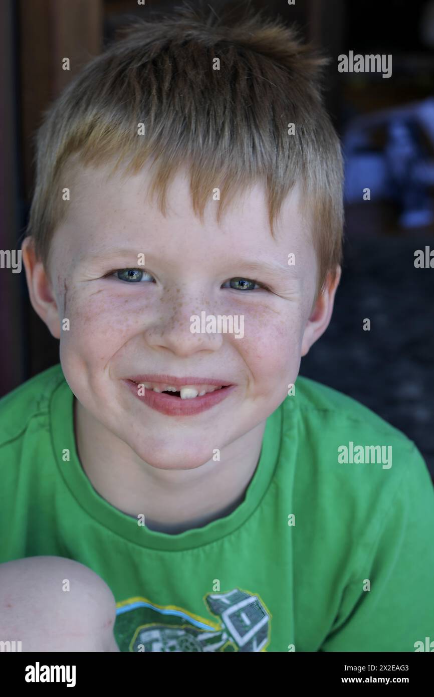 Cheerful boy with a bright, toothless grin Stock Photo