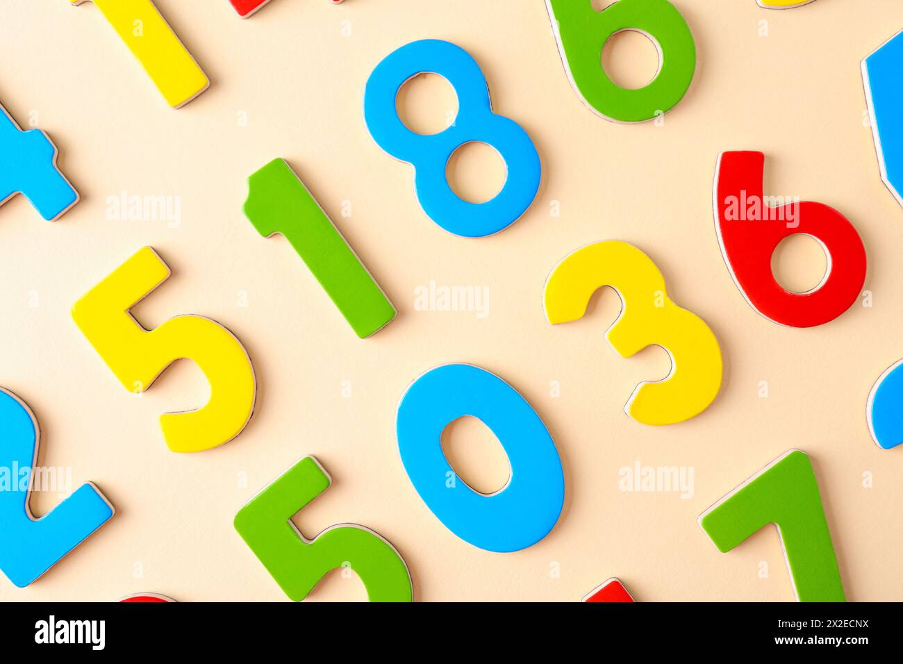 Colorful numbers on beige background, flat lay Stock Photo - Alamy