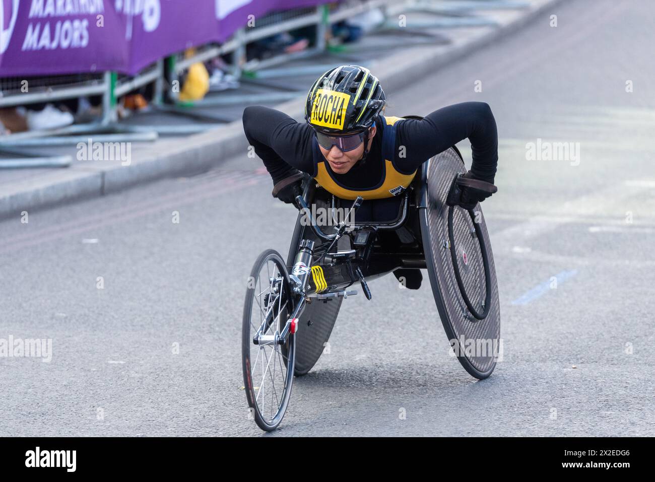 Aline Rocha competing in the TCS London Marathon 2024 passing through Tower Hill, London, UK. Stock Photo