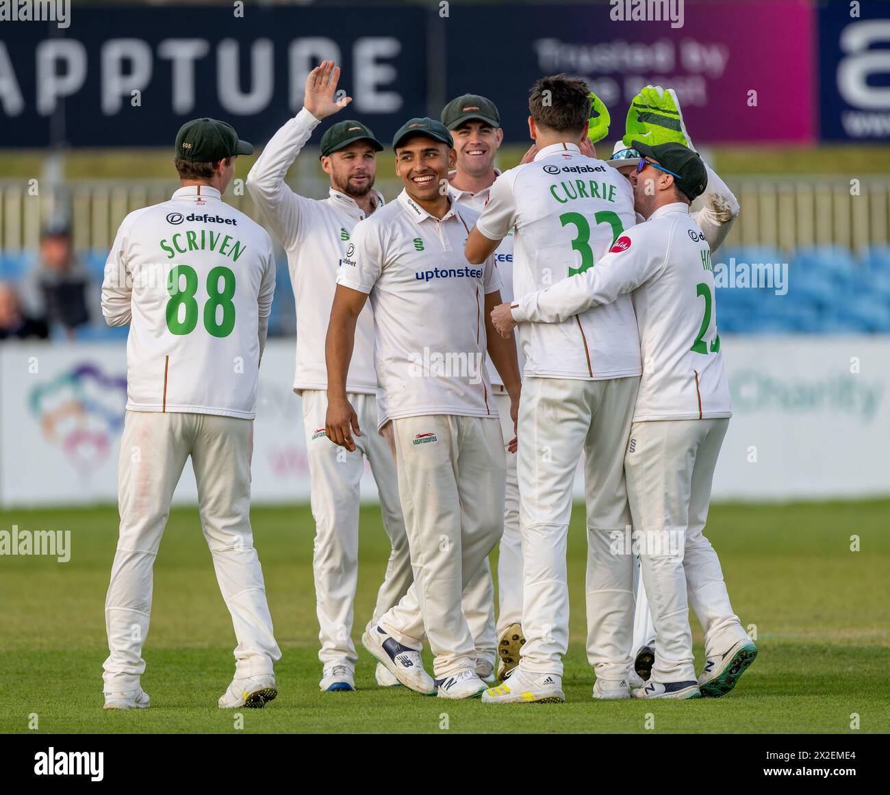 Leicestershire players celebrate the wicket of Brooke Guest in a Vitality County Championship match against Derbyshire Stock Photo