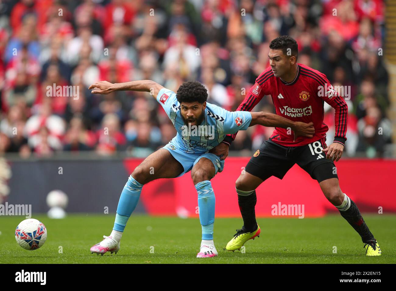 Ellis Simms of Coventry City and Casemiro of Manchester United - Coventry City v Manchester United, The Emirates FA Cup Semi Final, Wembley Stadium, London, UK - 21st April 2024 Stock Photo