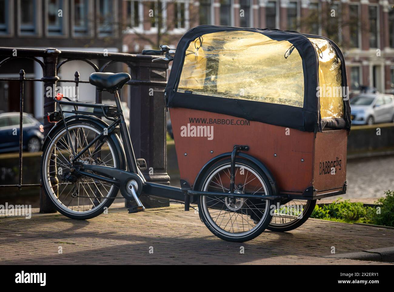 Haarlem, The Netherlands, 20.04.2024, The Babboe Big three-wheel cargo bike with a large box for children Stock Photo