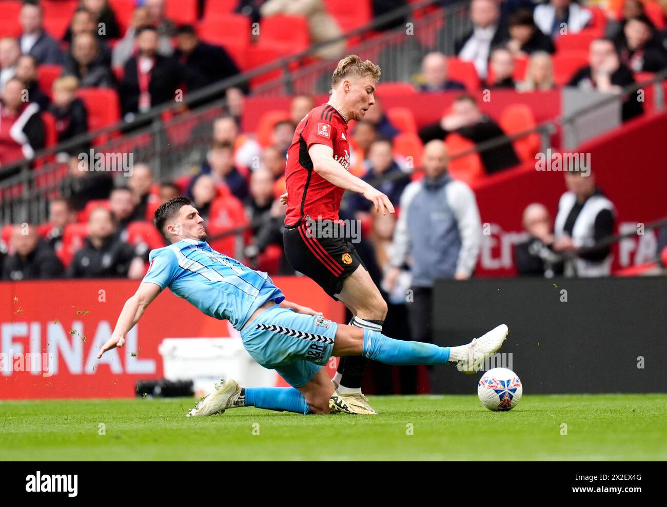 Coventry City's Bobby Thomas challenges Manchester United's Rasmus Hojlund during the Emirates FA Cup semi-final match at Wembley Stadium, London. Picture date: Sunday April 21, 2024. Stock Photo
