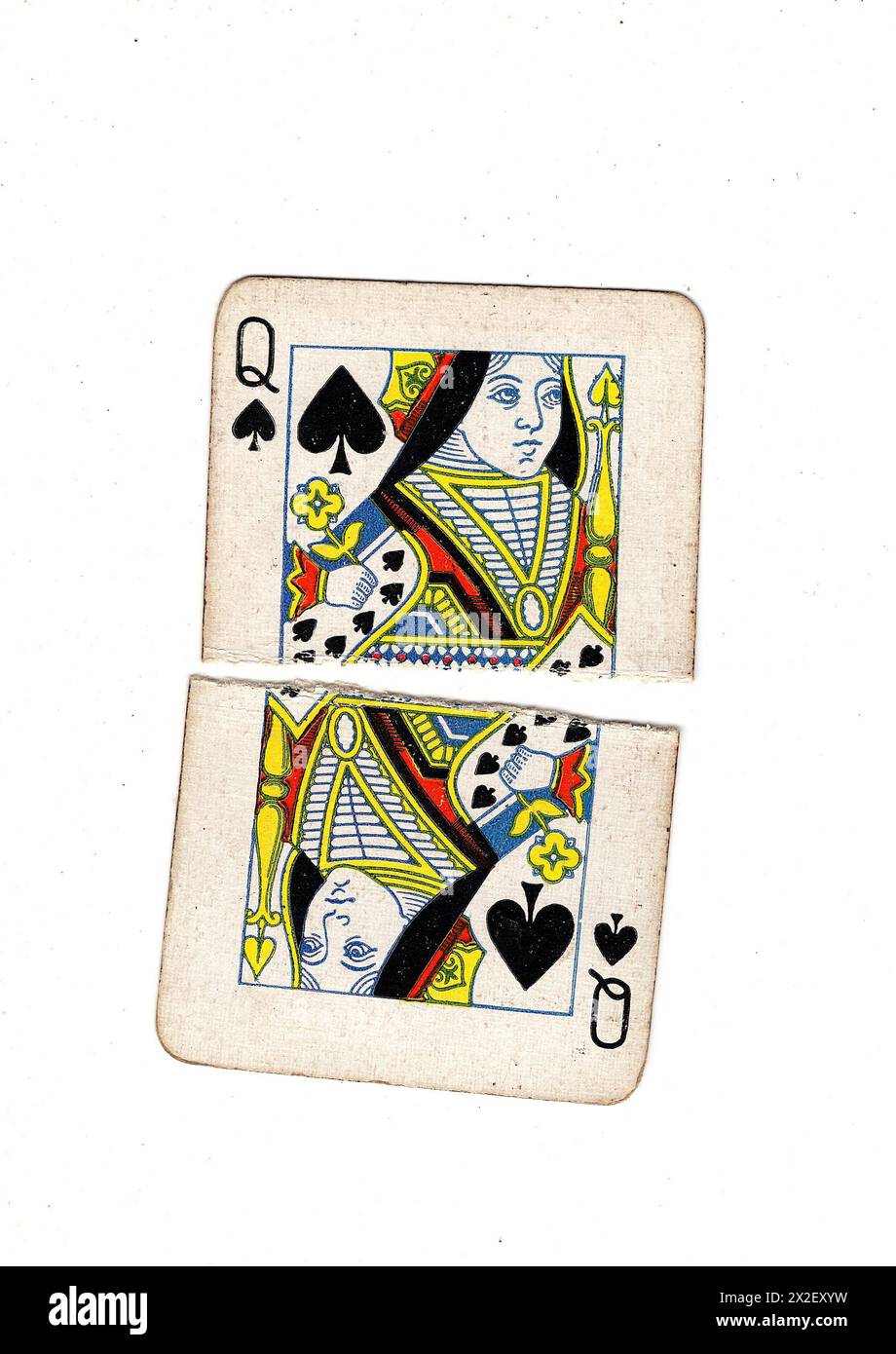Queen Card Ripped A vintage, well used queen of spades playing card torn in half on a ...
