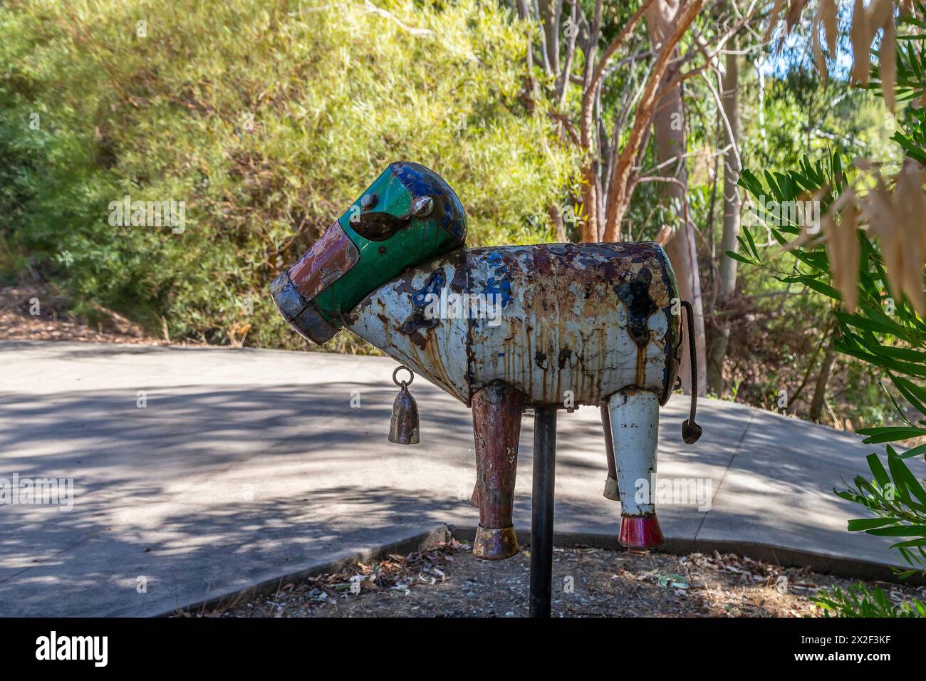 Old tin postbox with paint flaking in the shap of a animal, Bickley