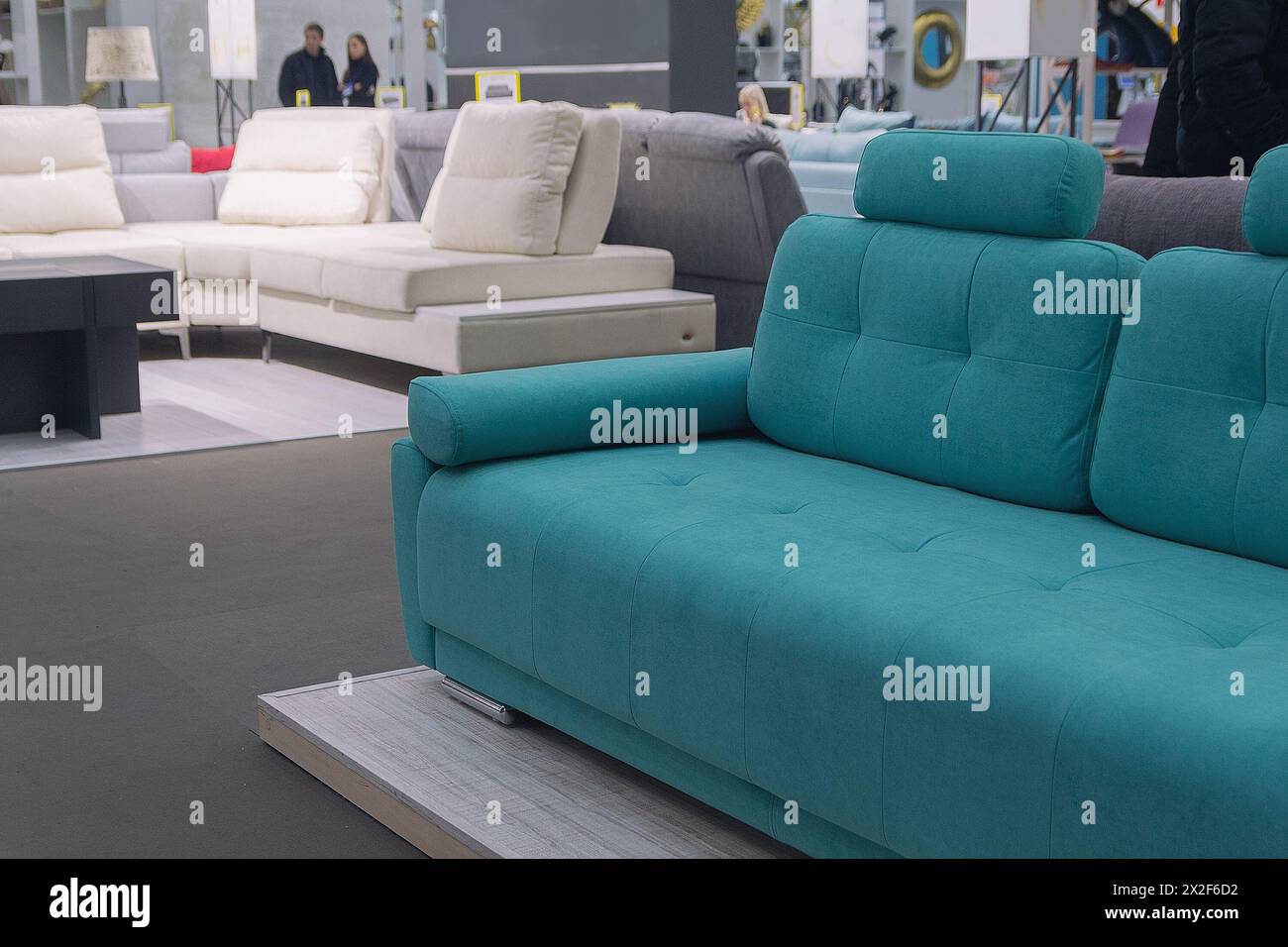 Modern sofas in the showroom of a furniture store. Industry Stock Photo