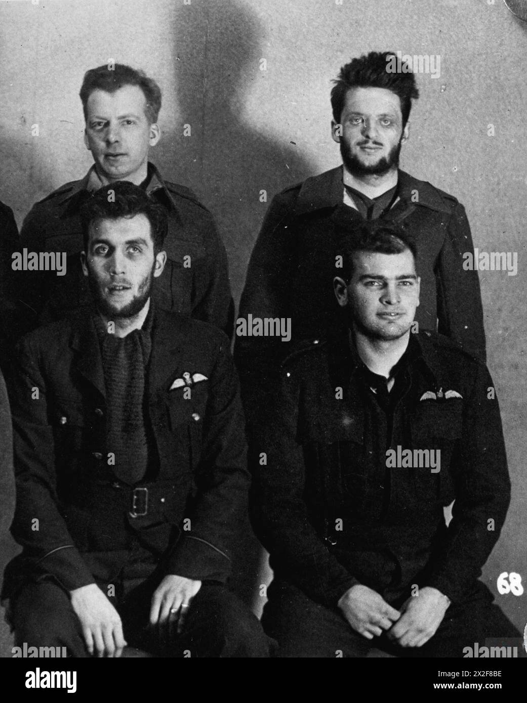 ALLIED PRISONERS OF WAR IN GERMANY, 1939-1945 - Four Canadian POWs at Stalag Luft III, Sagan.Top, left to right - Sam Sangster; John Gordon 'Scruffy' Weir.Below, left to right - Flight Lieutenant Clarke Wallace 'Wally' Floody; Flying Officer Henry 'Hank' Birkland, one of the Great Escapers murdered by the Gestapo Royal Canadian Air Force, Floody, Clarke Wallace 'Wally', Birkland, Henry 'Hank' Stock Photo