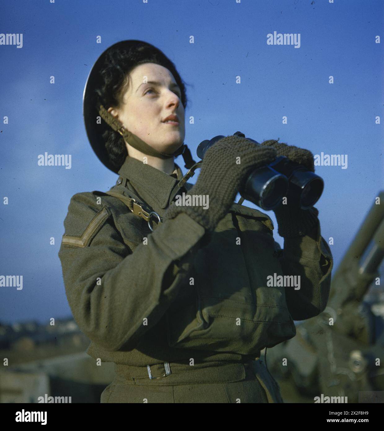 An ATS spotter observes from an anti-aircraft command post in Britain ...