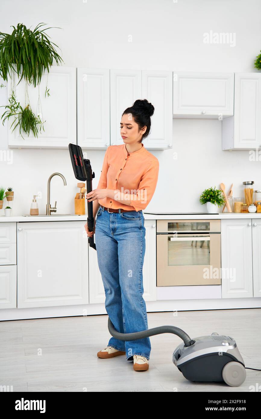 a-stylish-woman-in-casual-attire-gracefully-vacuums-the-kitchen-floor
