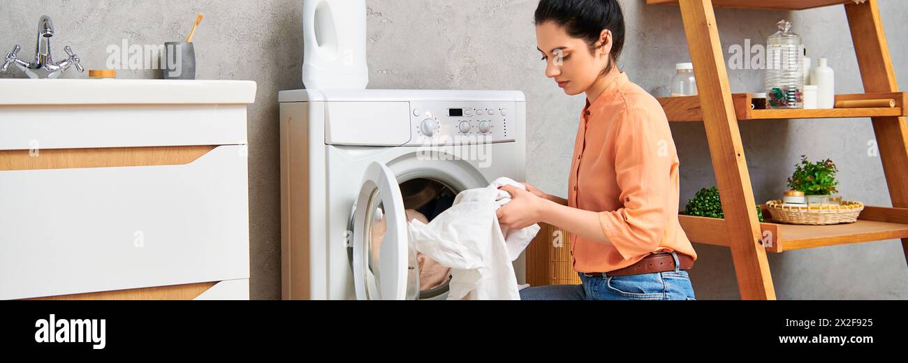 A stylish woman in casual clothing gracefully places a cloth into a ...