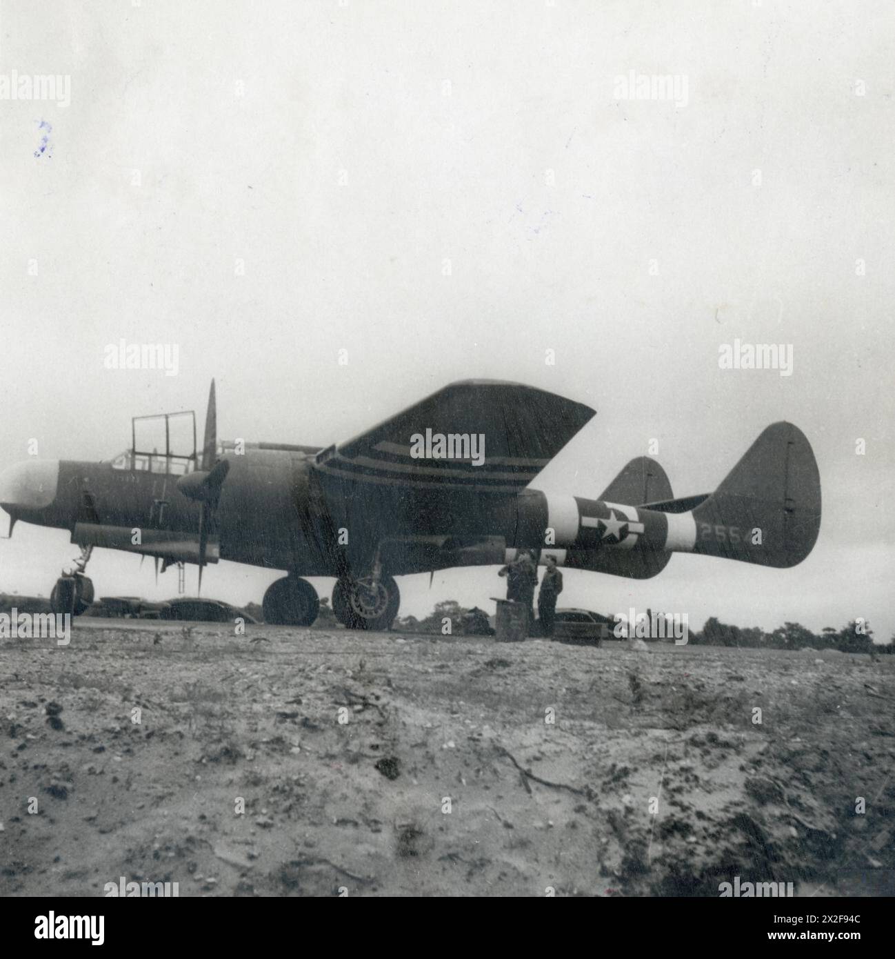 UNITED STATES ARMY AIR FORCES (USAAF) IN BRITAIN, 1942-1945 - A P-61 Black Widow (serial number 42-5547) of the 422nd Night Fighter Squadron.Image stamped on reverse: 'Keystone Press.'[stamp], 'Not to be published 24 Jul 1944.' [stamp], 'Passed for publication 24 Aug 1944.' [stamp] and '342471.' [Censor no]Printed caption on reverse: 'Newest Night Fighter Is Called The 'Black Widow'. The very latest nght fighter, the P-61, known as the 'Black Widow', has commenced operations. This powerful plane is driven by two 2,000 h.p. Pratt and Whitney motors and is armed with cannons. It looks very much Stock Photo