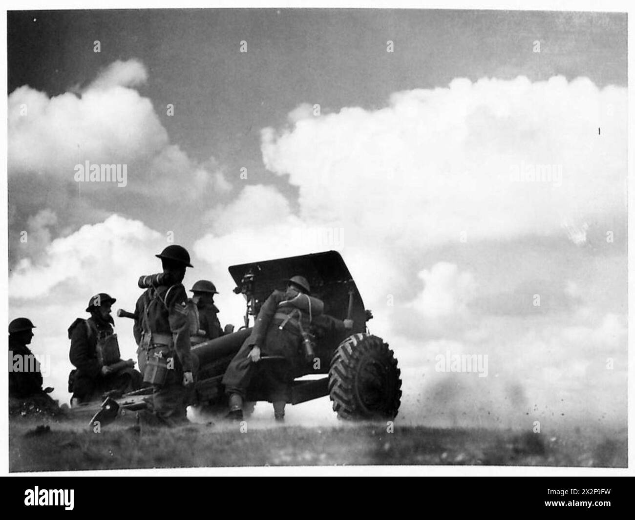 A British Army gun is fired during an artillery exercise to train ...