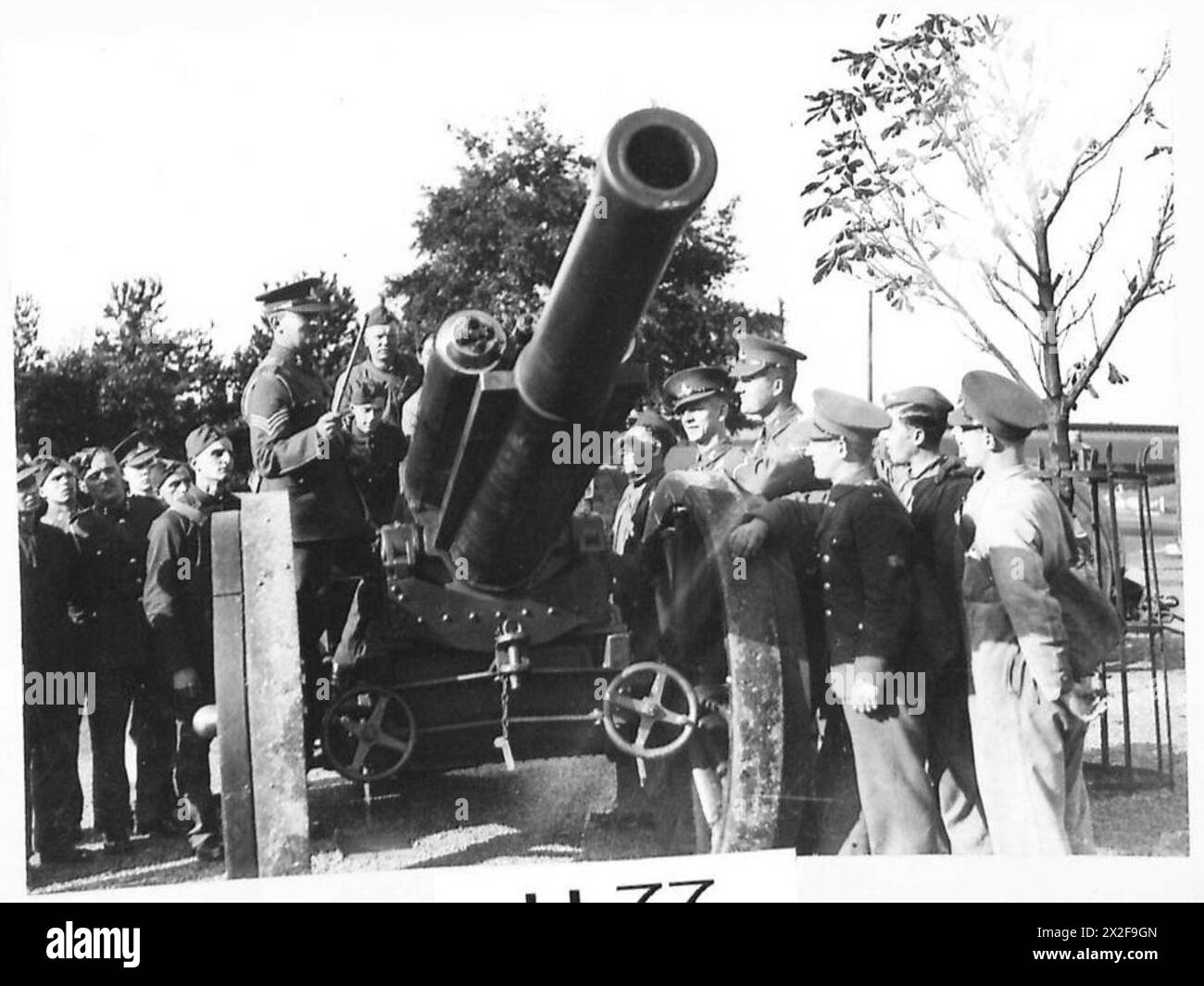 SCHOOL OF ARTILLERY The R.A. instructor lecturing the men on a 6