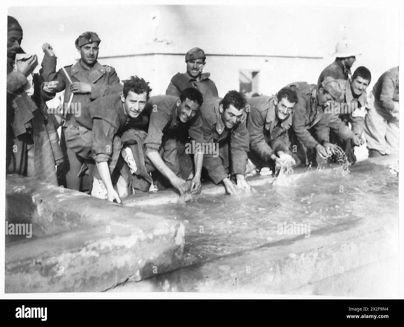 Captured Italian prisoners of war wash themselves following capture by ...