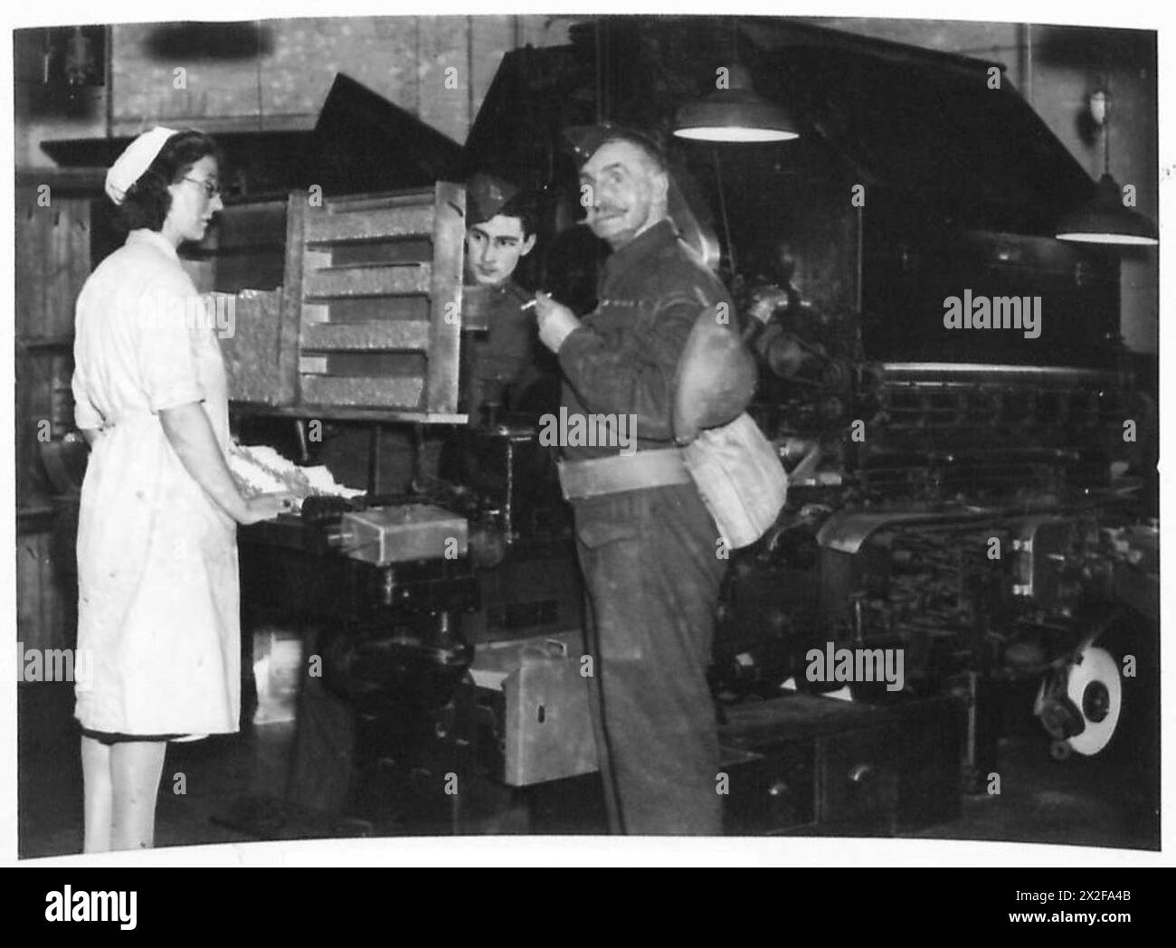 A promotional cigarette stunt organized by Rothman and Martins involving  British Army personnel, likely for morale or advertising purposes during  wartime Stock Photo