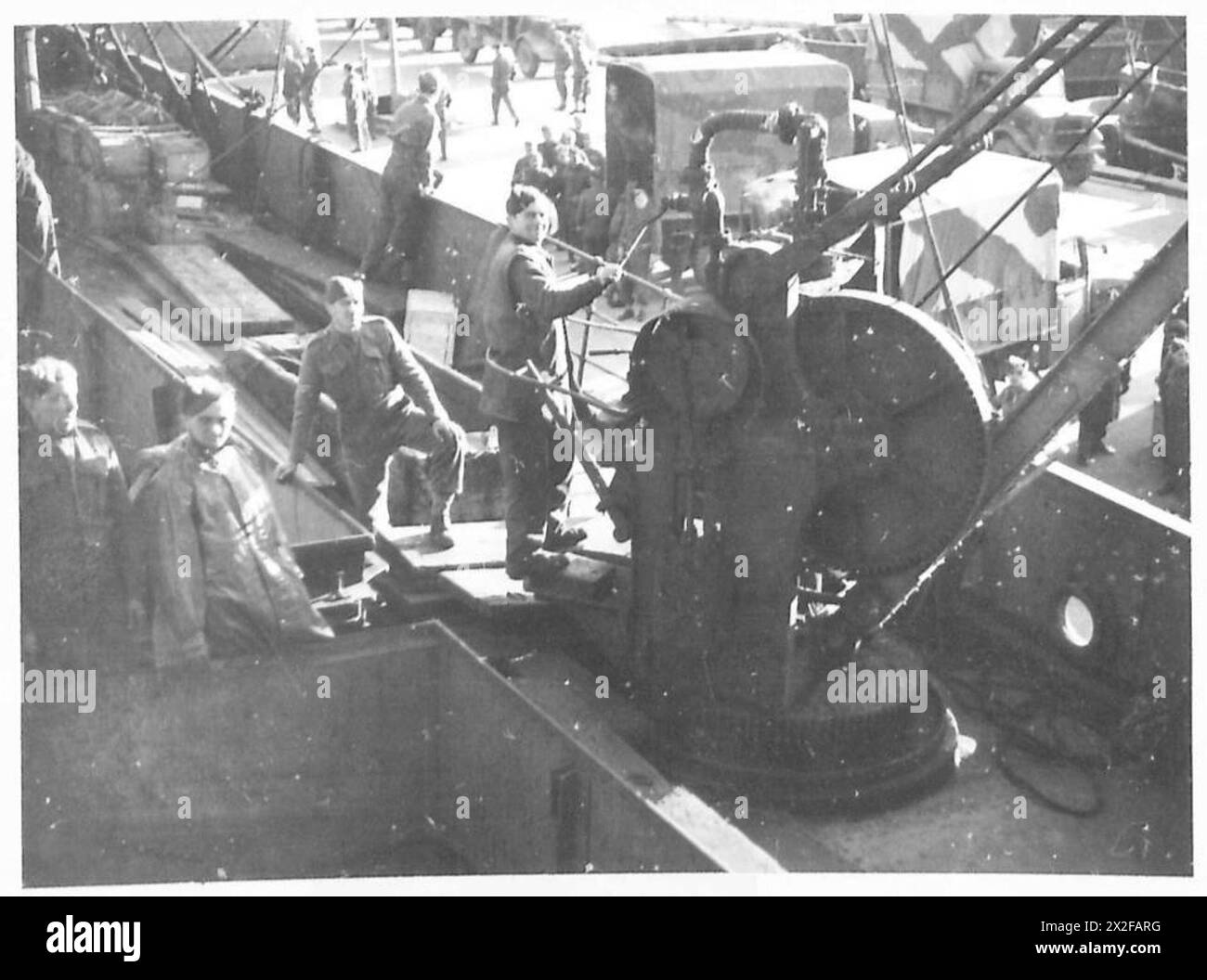 WITH BRITISH AND CANADIAN TROOPS IN ICELAND - An A.M.P.C. winch man at ...