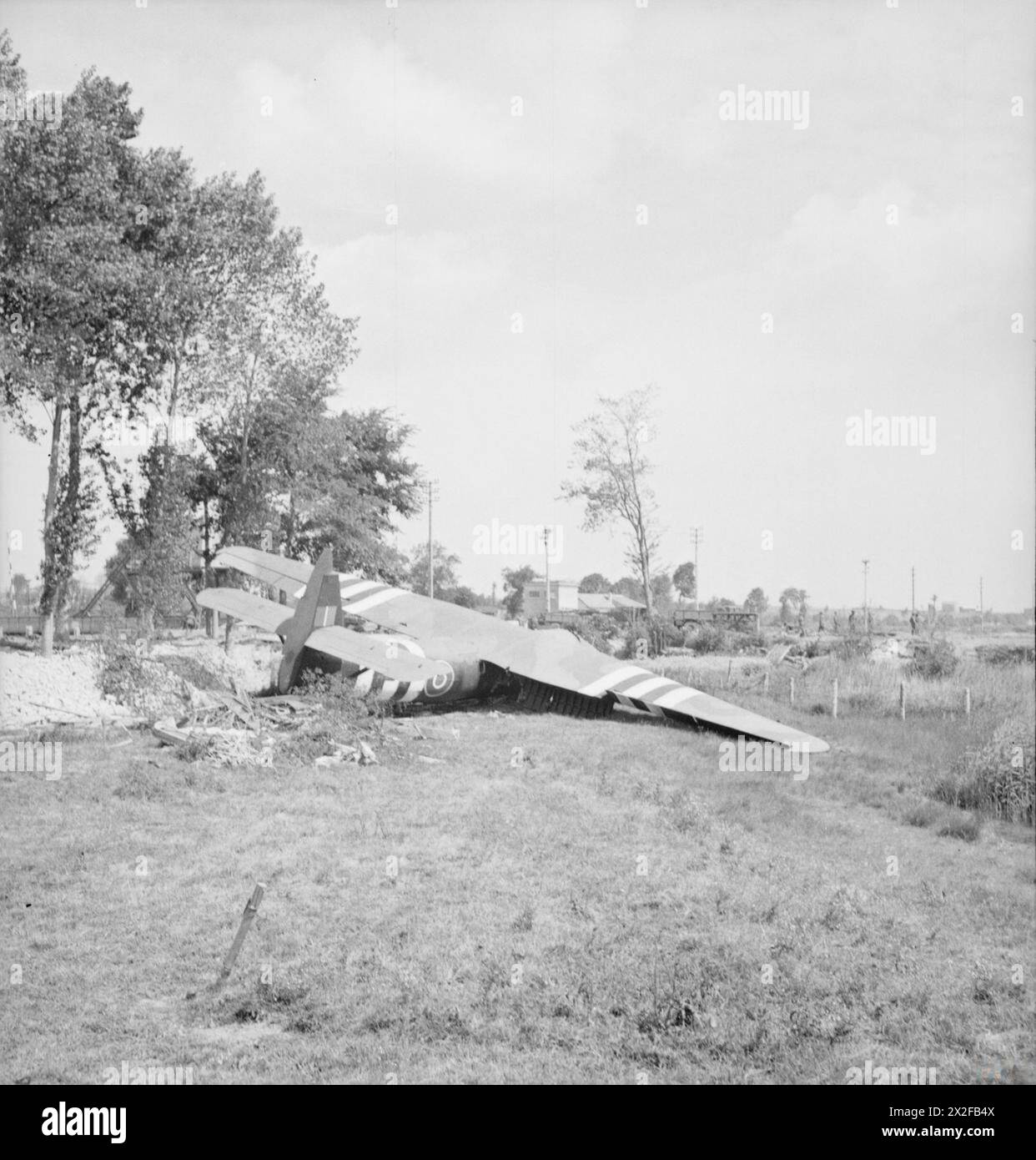 THE BRITISH ARMY IN THE NORMANDY CAMPAIGN 1944 - A Horsa glider near the Caen Canal bridge ('Pegasus Bridge') at Benouville, 10 June 1944, part of 6th Airborne Division's 'coup de main' force, carrying men of 'D' and 'B' Company, 2nd Battalion Oxfordshire and Buckinghamshire Light Infantry, which captured the bridges over the Orne River and Caen Canal in the early hours of D-Day. This is glider No. 91, which carried the force commander, Major John Howard, and Lieutenant Den Brotheridge's platoon Stock Photo