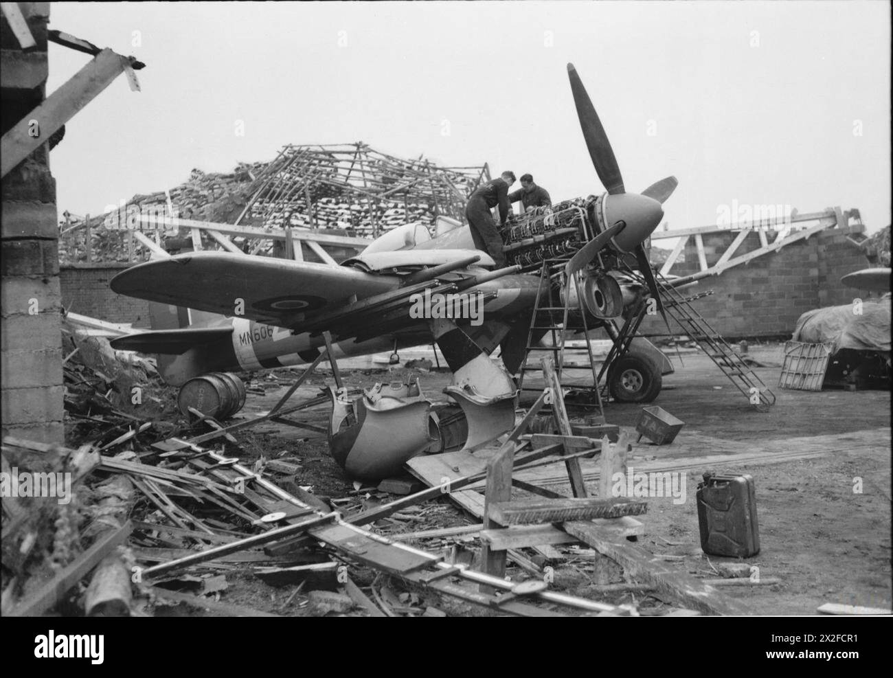 ROYAL AIR FORCE: 2ND TACTICAL AIR FORCE, 1943-1945. - Hawker Typhoon Mark IB, MN606, of No. 247 Squadron RAF, being overhauled by a Repair and Salvage Unit in a dispersal wrecked by the retreating Luftwaffe at B78/Eindhoven, Holland Royal Air Force, Wing, 247, Royal Air Force, Maintenance Unit, 201 Stock Photo