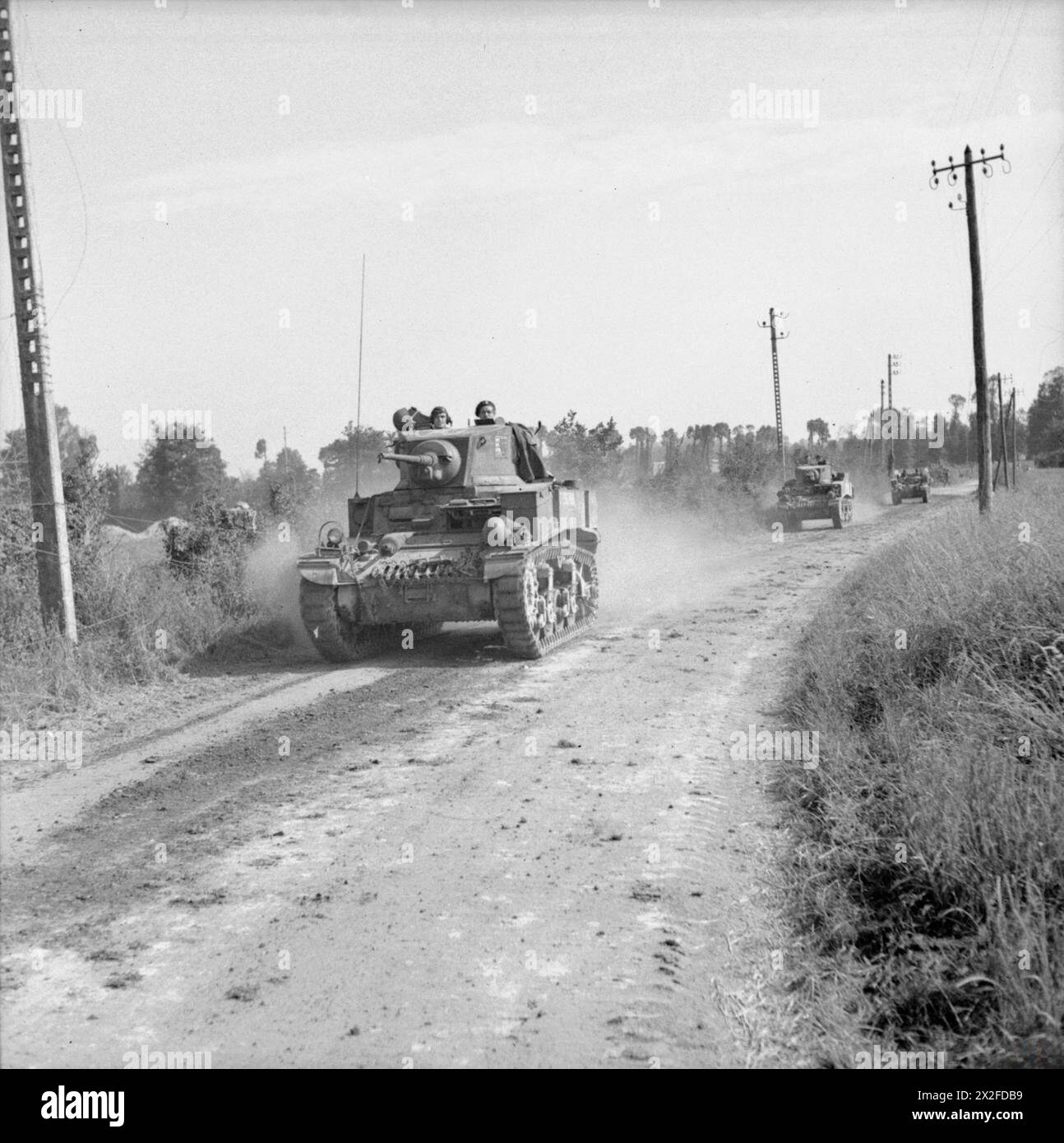 THE BRITISH ARMY IN THE NORMANDY CAMPAIGN 1944 - Stuart tanks moving up ...