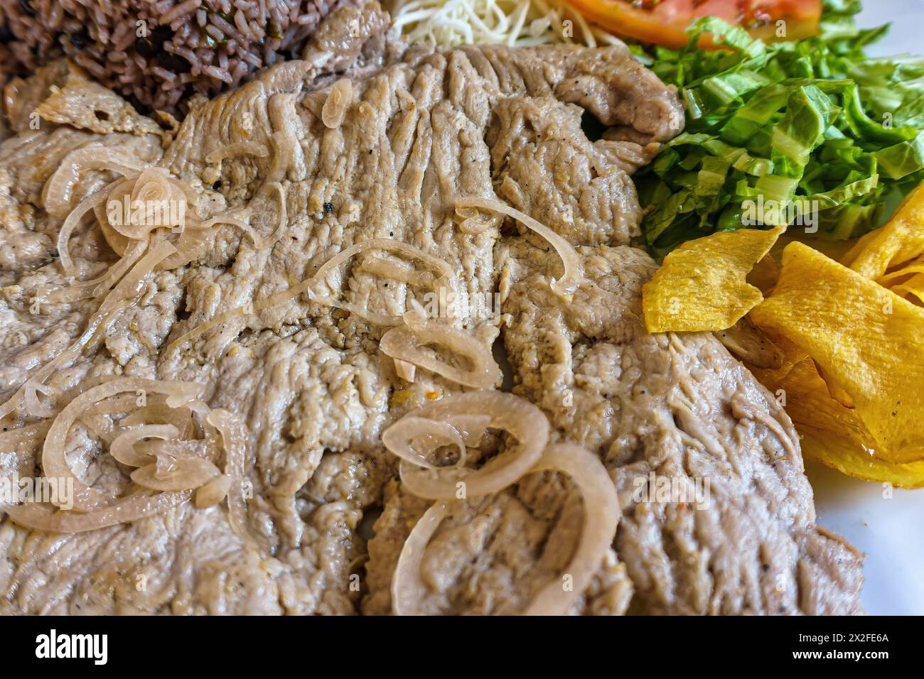 Pork steak, congri rice. Cuban cuisine Stock Photo - Alamy