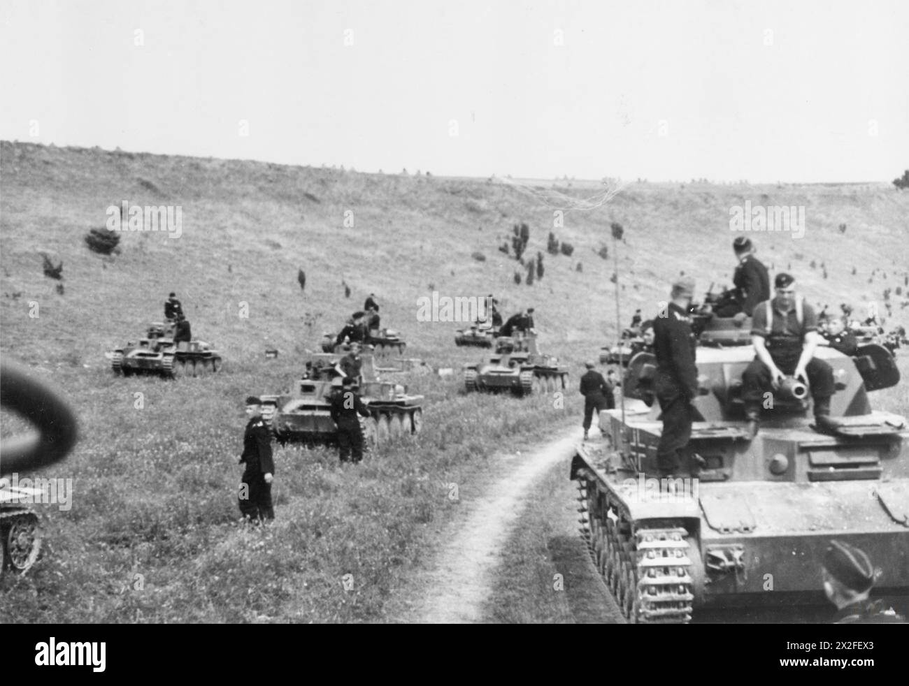 THE BATTLE OF FRANCE, MAY-JUNE 1940 - A column of German PzKpfw MkIV and Czech-built PzKpfw 38(t)s tanks halted in valley in escarpment on the far side of the Somme river after Rommel's force had crossed the river, 26 May-4 June 1940.Film exists of Rommel crossing a small bridge and heading south to cross the Paris-Calais railway line proving this photograph must have been taken after his force crossed the river German Army Stock Photo