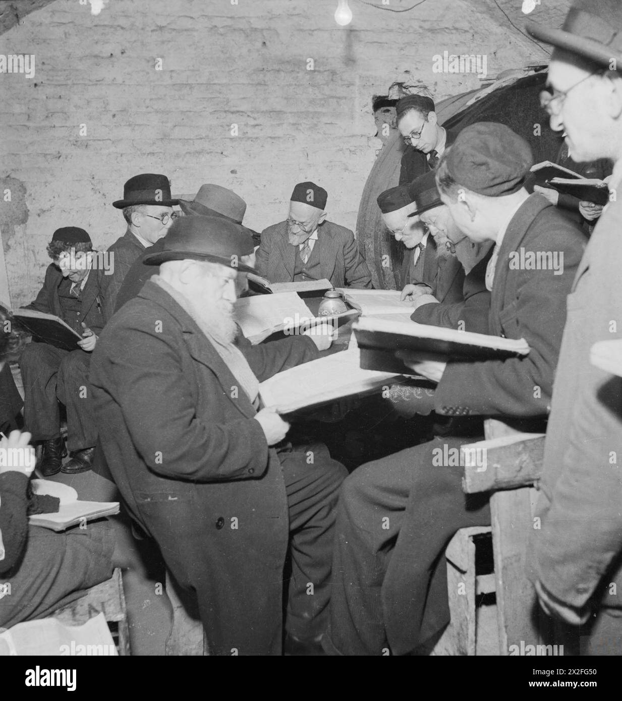 Orthodox Jews study the Talmud in the East End Wine Merchant's cellar ...