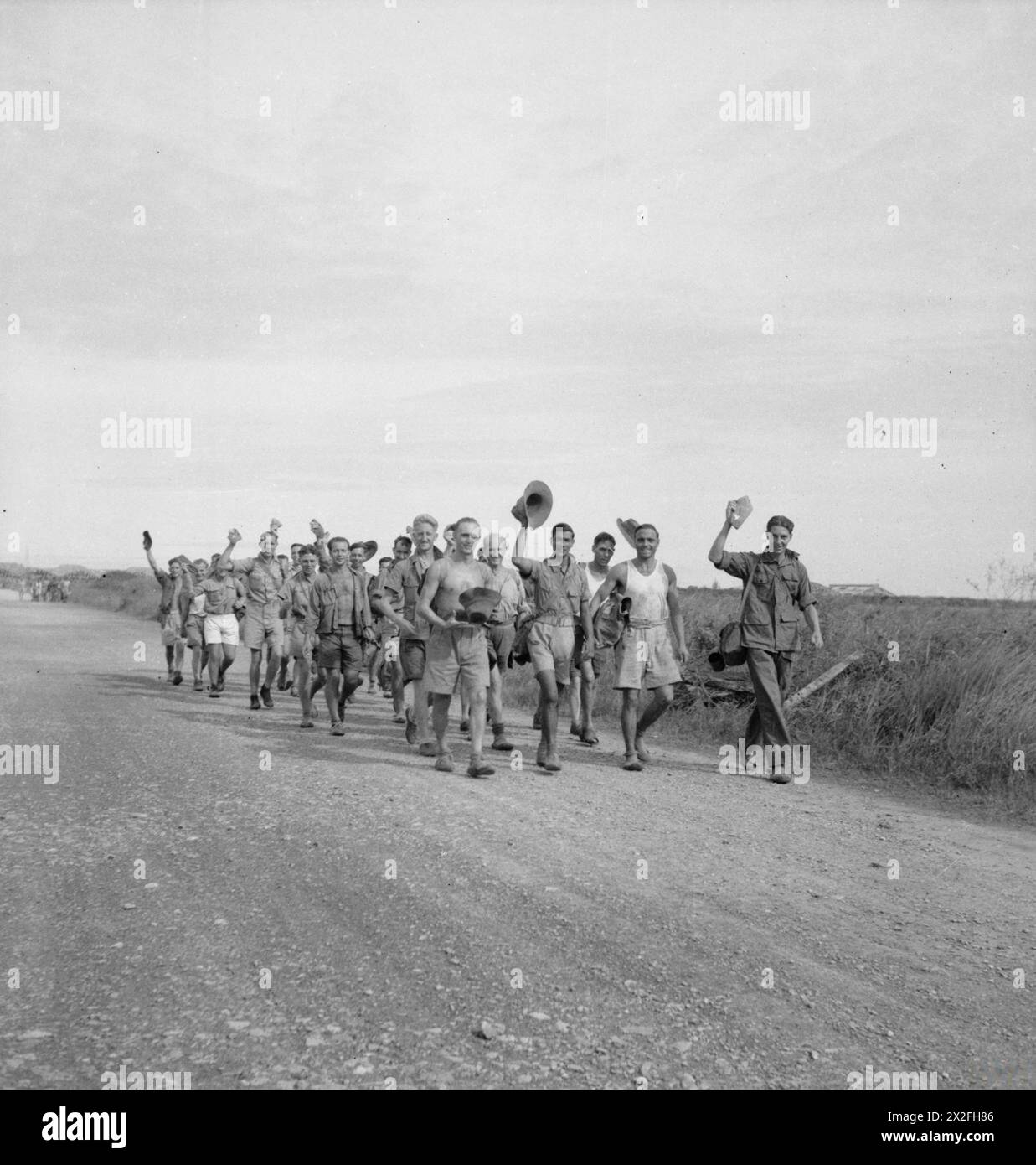 Recently released British prisoners of war march toward an airfield in ...