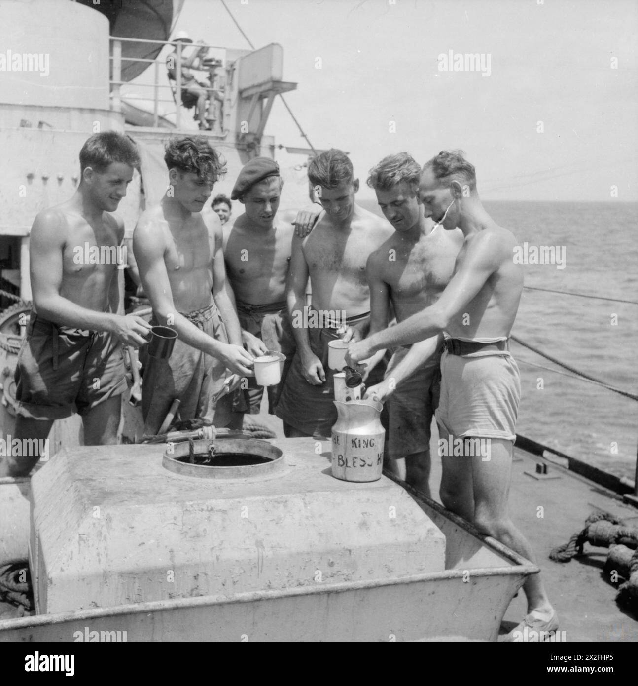 Men of the 3rd Commando Brigade receive rum rations aboard Landing Ship ...