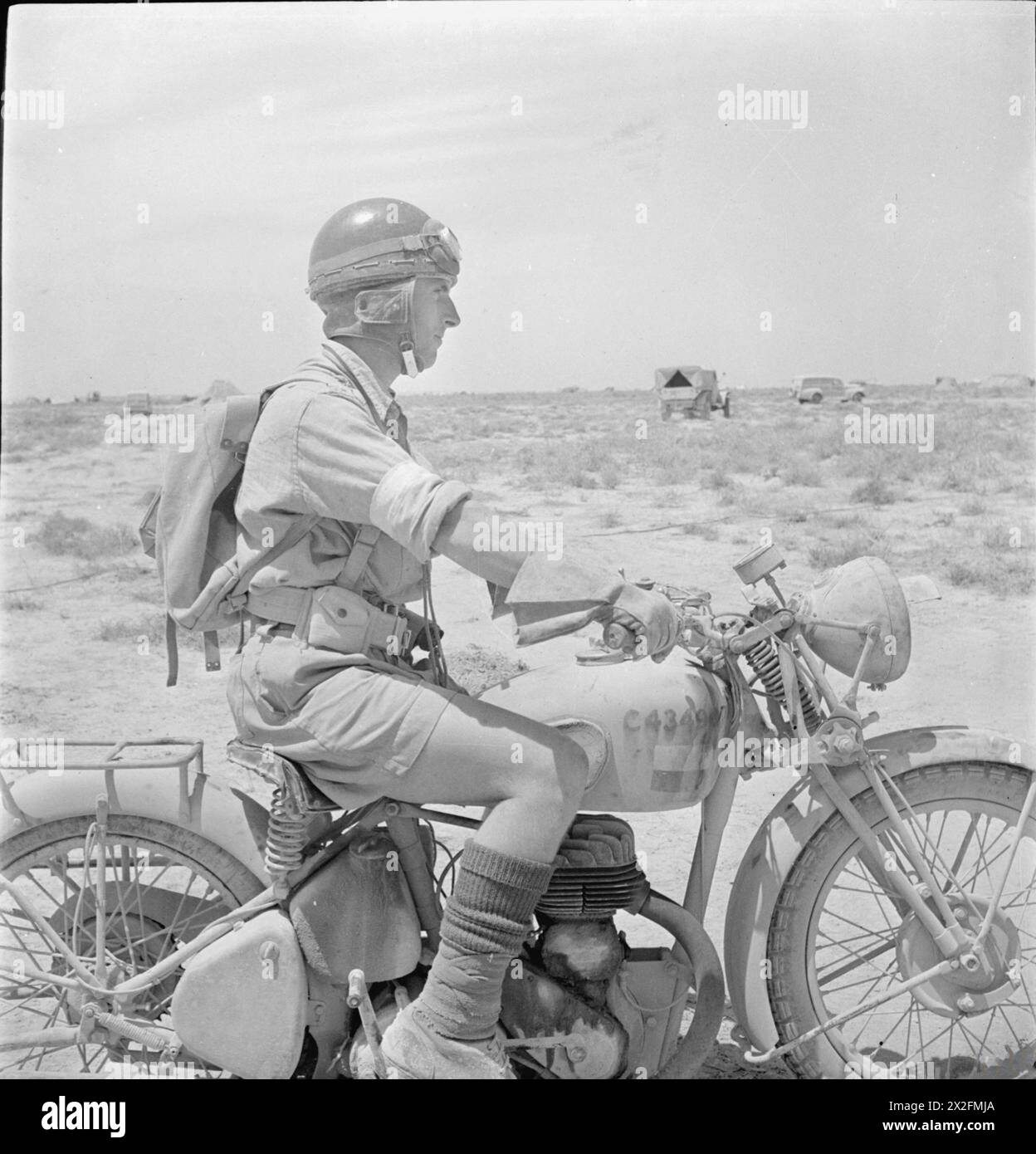 A British Army despatch rider is photographed on his motorcycle in the ...