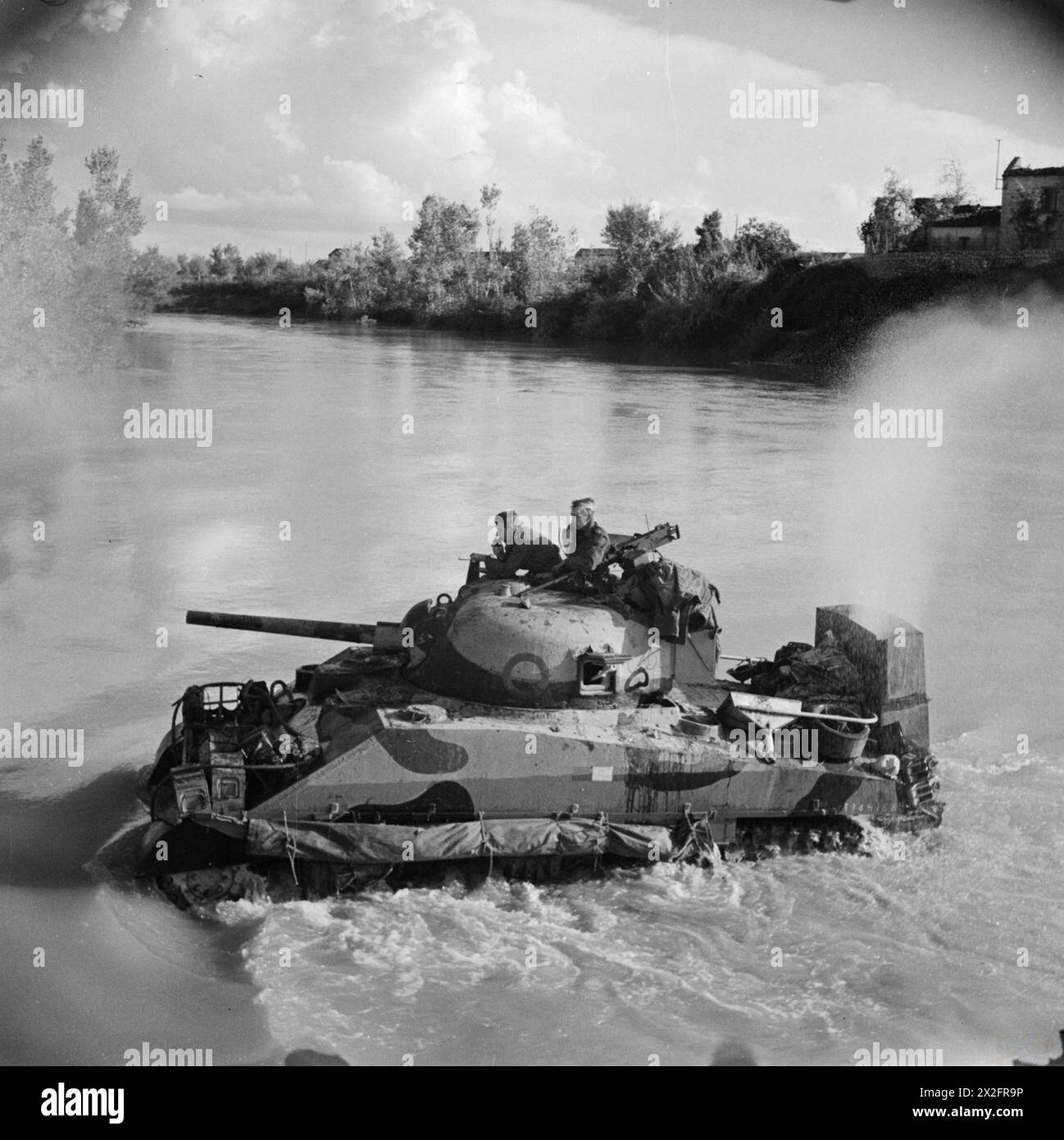 A Sherman tank of the 4th County of London Yeomanry fords the Volturno ...