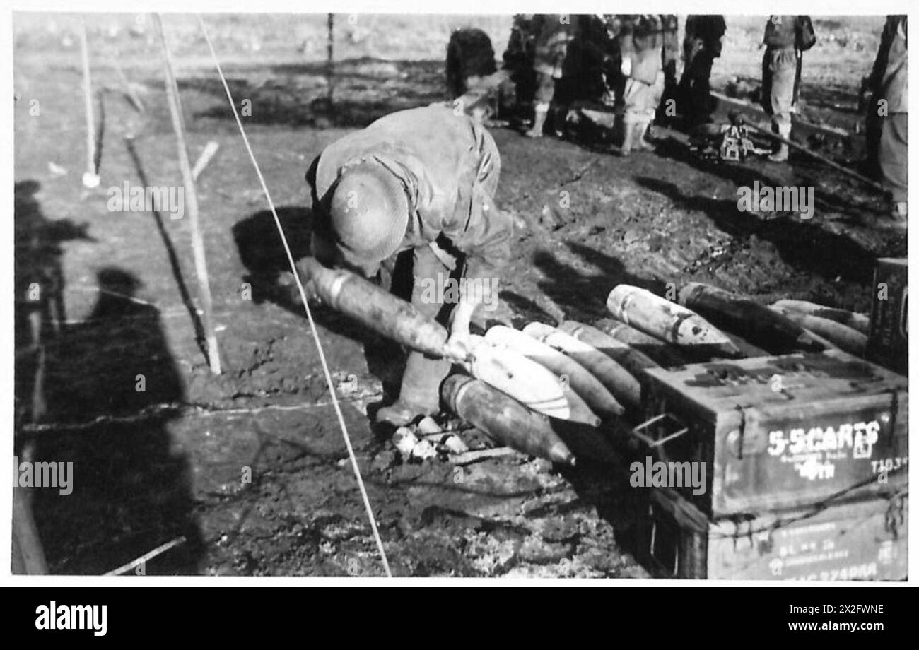 Howitzer Shell Fuse Gunner H. Panting of Gloucester fuses shells for a 5.5-inch gun ...