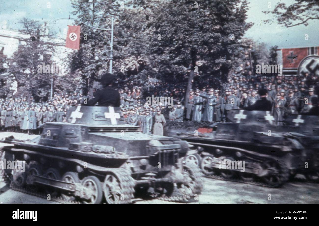THE GERMAN-SOVIET INVASION OF POLAND, 1939 - Hitler reviewing a victory parade in Warsaw, following the conclusion of the joint Nazi-Soviet campaign against Poland, 5 October 1939. A squadron of German Pzkpfw I Ausf. B tanks are passing the saluting base. The Second World War began when Germany invaded Poland on 1 September 1939. Britain and France declared war in response, but despite earlier assurances did nothing to help the Poles. Hitler, banking on western acquiescence, had already concluded a non-aggression pact with his ideological enemy, the Soviet Union, which launched its own assault Stock Photo