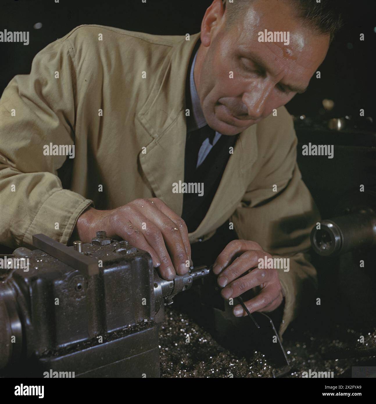 AIRCRAFT PRODUCTION IN BRITAIN, 1944 Mr Lovering, a worker in the Sleeve Crank Section, of the
