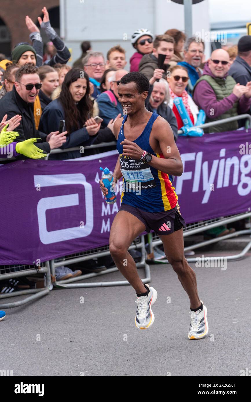 Seyfu Jamaal competing in the TCS London Marathon 2024 passing through Tower Hill, London, UK. London Heathside club runner Stock Photo