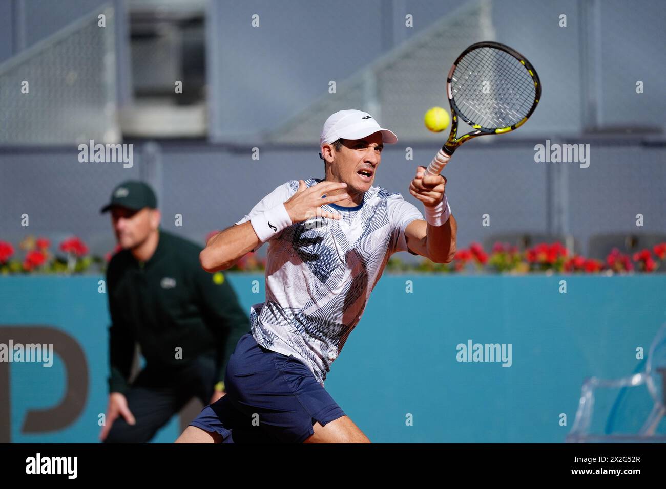 Facundo Bagnis of Argentina in action against David Goffin of Belgium during the Mutua Madrid Open 2024, ATP Masters 1000 and WTA 1000, tennis tournament on April 22, 2024 at Caja Magica in Madrid, Spain Stock Photo