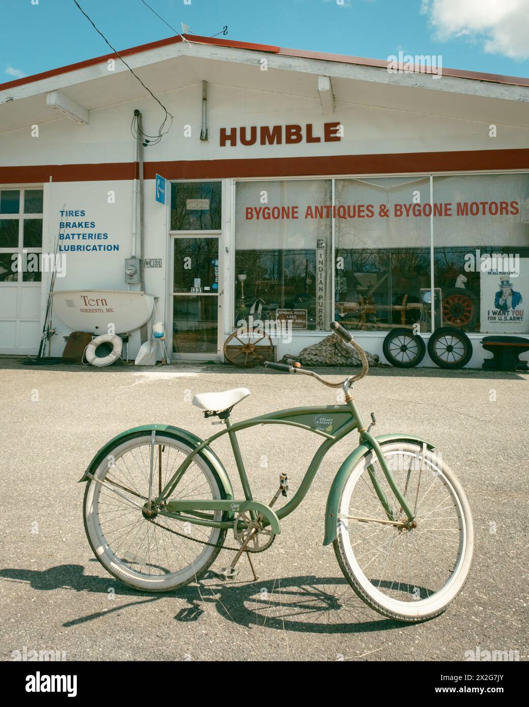 Bicycle and old service station in Harrington, Maine Stock Photo