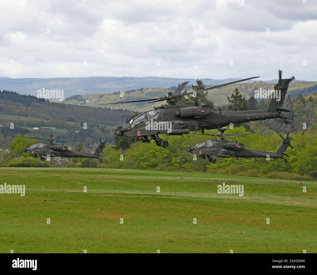 Baumholder, Germany. 17 April, 2024. U.S Army AH-64E Apache attack helicopters with the 1st Battalion, 3rd Aviation Regiment take off from a temporary Airfield on the Baumholder Maneuver Training Area, April 17, 2024, in Baumholder, Germany.  Credit: Ruediger Hess/US Army Photo/Alamy Live News Stock Photo