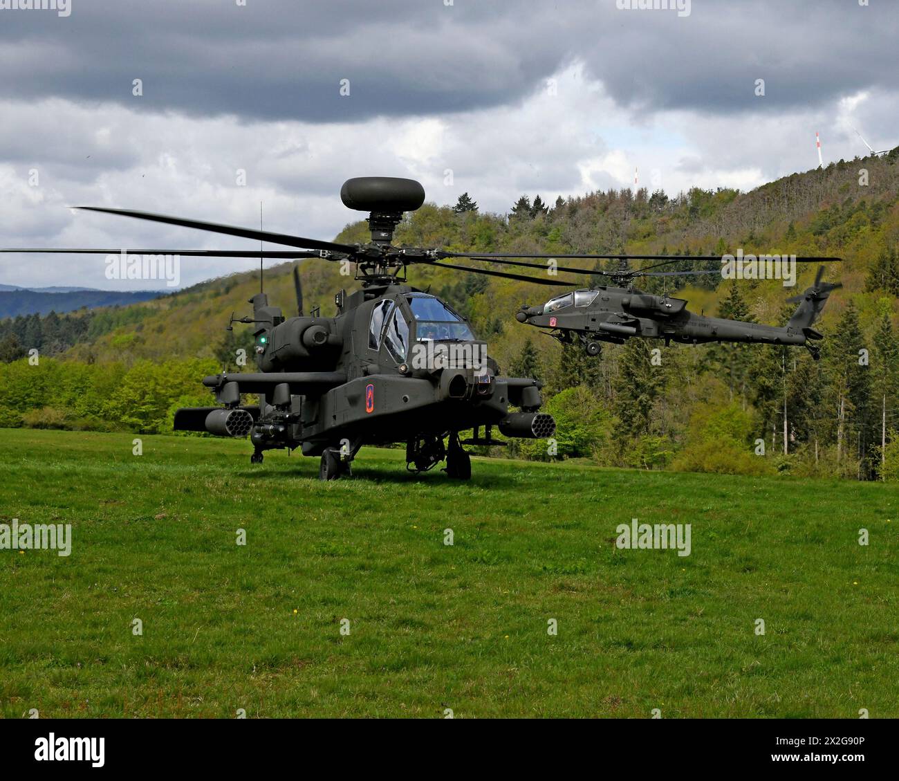 Baumholder, Germany. 17 April, 2024. U.S Army AH-64E Apache attack helicopters with the 1st Battalion, 3rd Aviation Regiment take off from a temporary Airfield on the Baumholder Maneuver Training Area, April 17, 2024, in Baumholder, Germany.  Credit: Ruediger Hess/US Army Photo/Alamy Live News Stock Photo