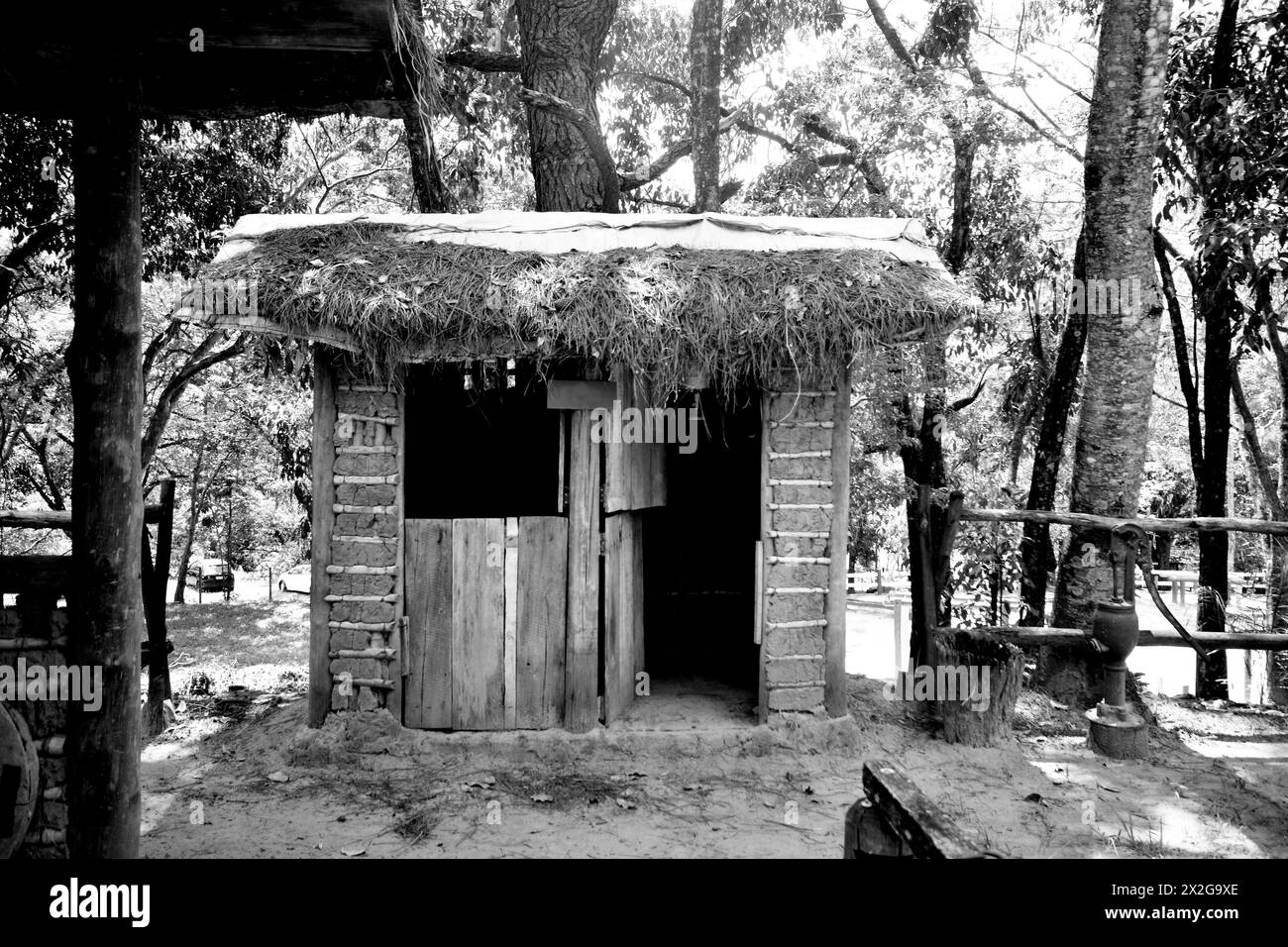 Old bathroom made with clay and wood used in the 50s or 60s. monochrome Stock Photo