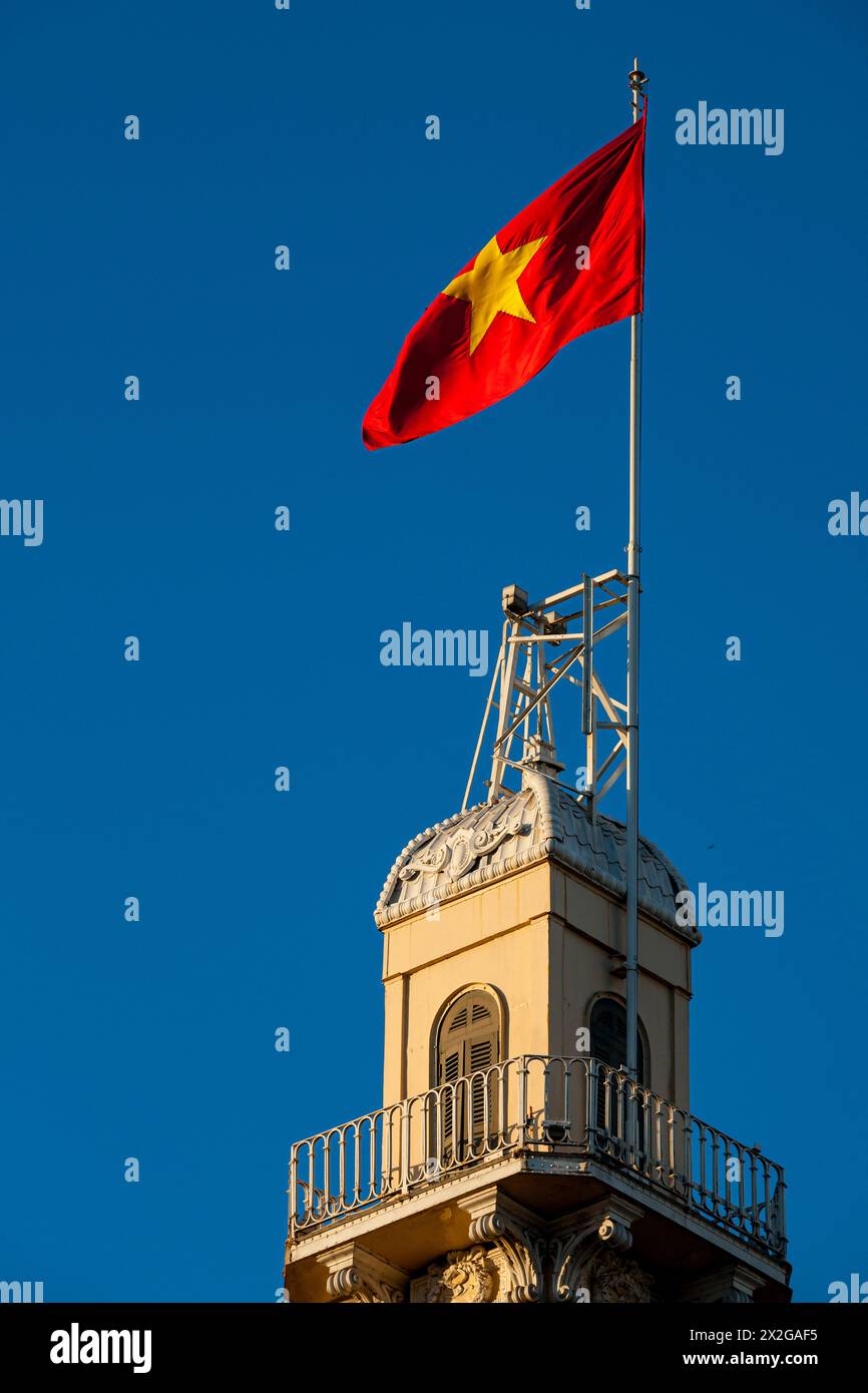 Vietnam, Ho Chi Minh City, Saigon, Buildings and Flag Stock Photo