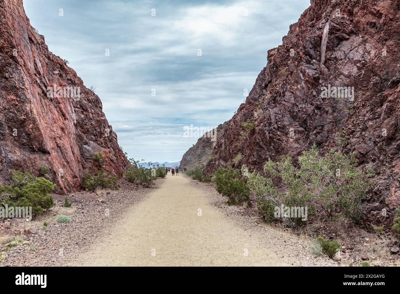 Visitors walking on the Historic Railroad Trail in the desert next to Lake Mead near Boulder City, Nevada Stock Photo