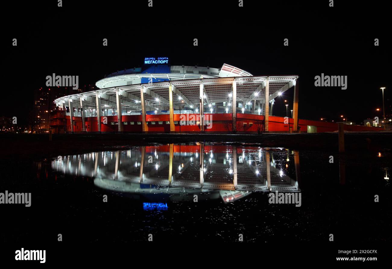 MOSCOW - MARCH 28: Palace of Sports Megasport at night on March 28, 2010 in Moscow, Russia. Form of buildings reminiscent screw - cylindrical volume w Stock Photo
