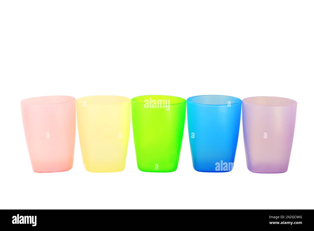 Colorful plastic glasses of various color isolated on white background ...
