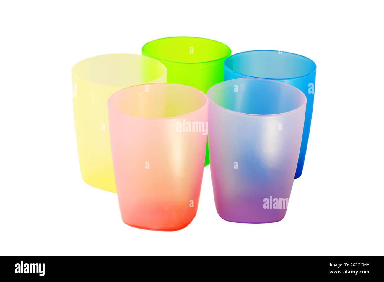 Five colorful plastic glasses of various color isolated on white ...